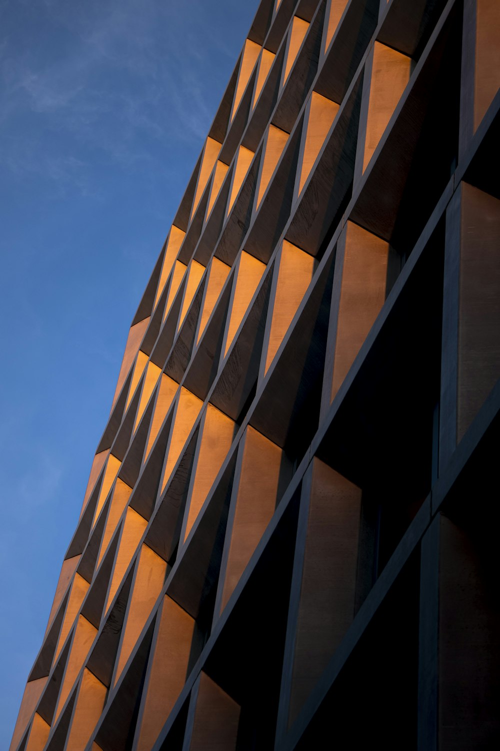 a very tall building with a sky in the background