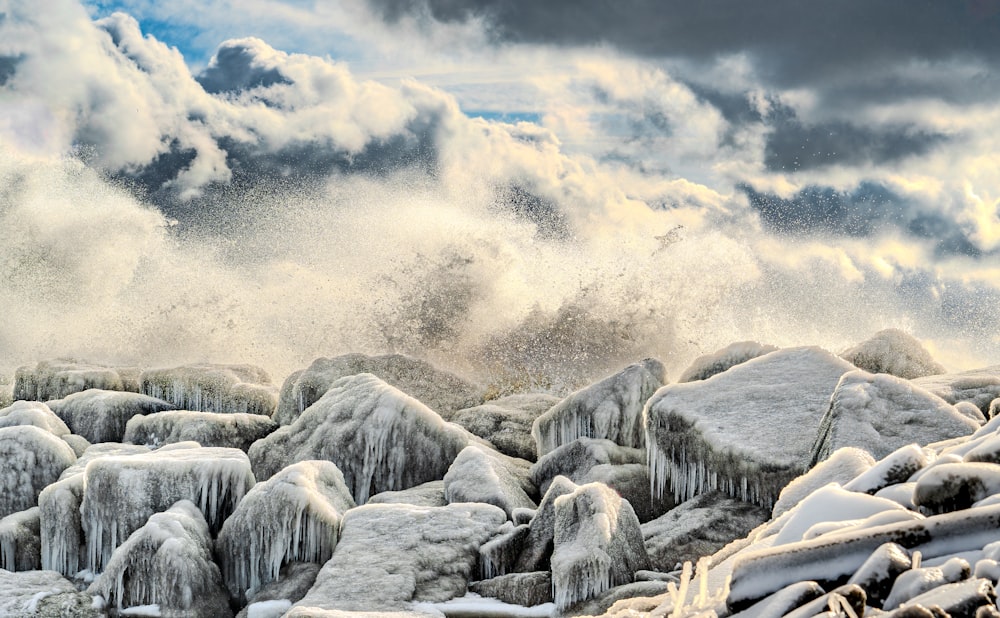 a large amount of ice and snow on rocks