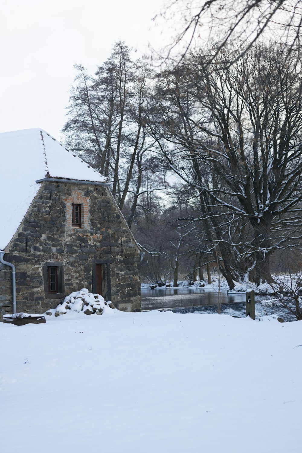 a stone building with a clock on the front of it