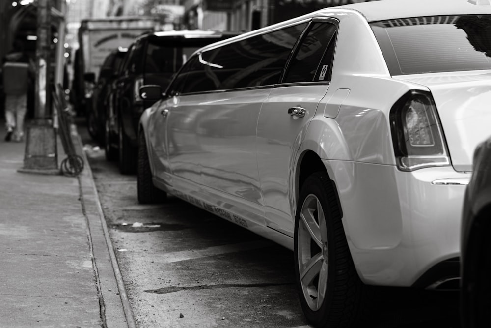 a line of parked cars on a city street