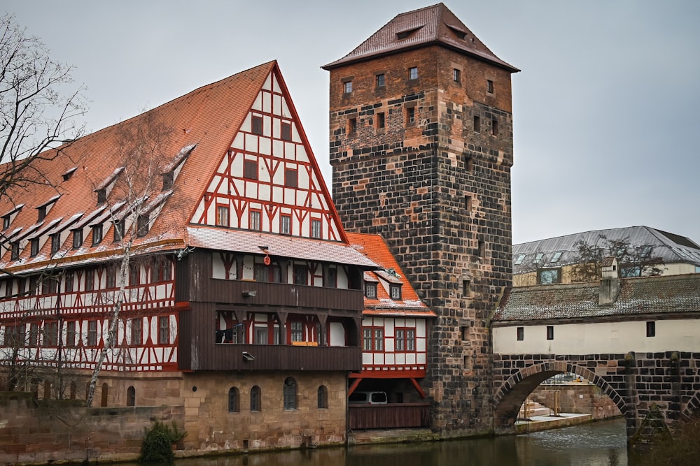 a building with a tower next to a bridge