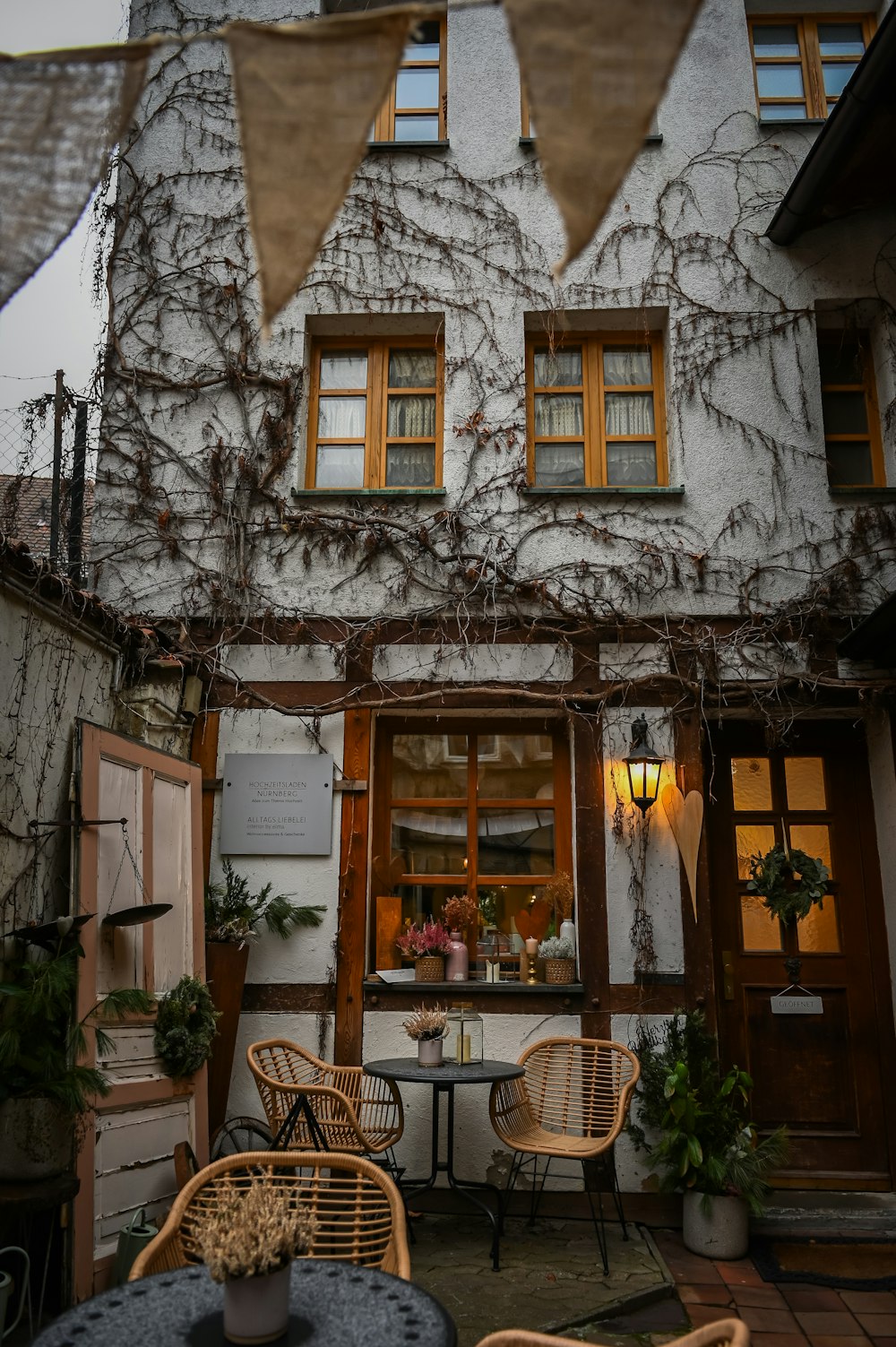 a house with vines growing on the side of it