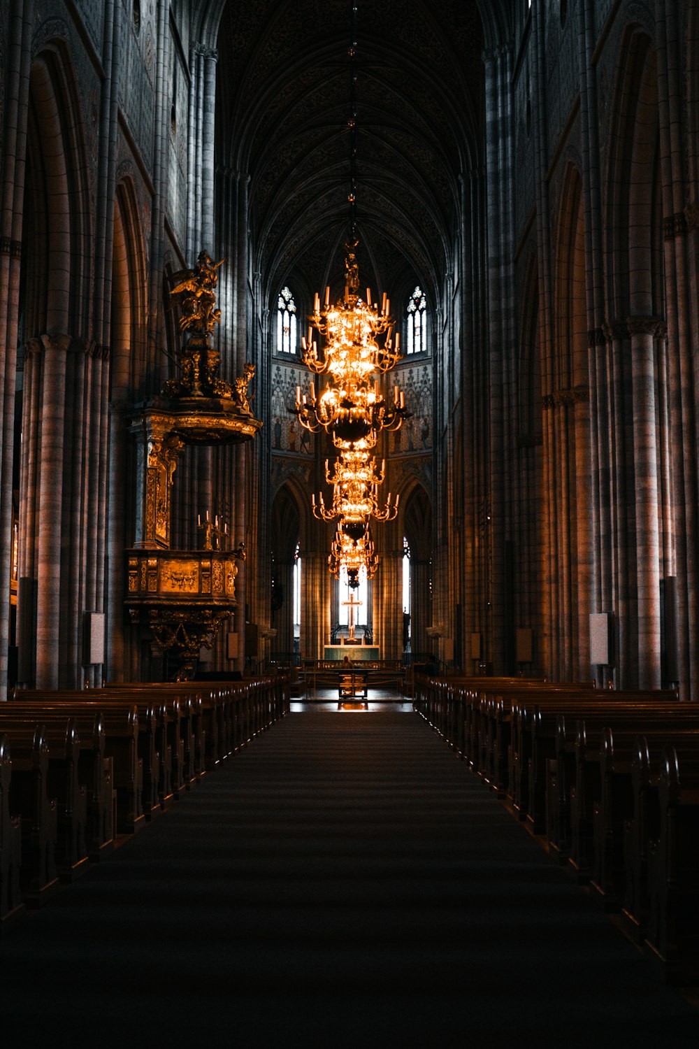 a large cathedral with a chandelier hanging from the ceiling