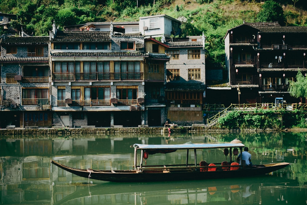 a small boat floating on top of a river