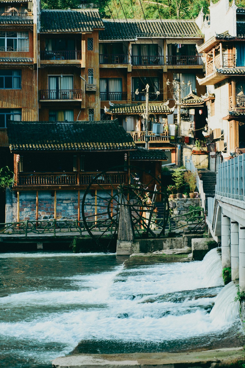 a river running through a city next to tall buildings