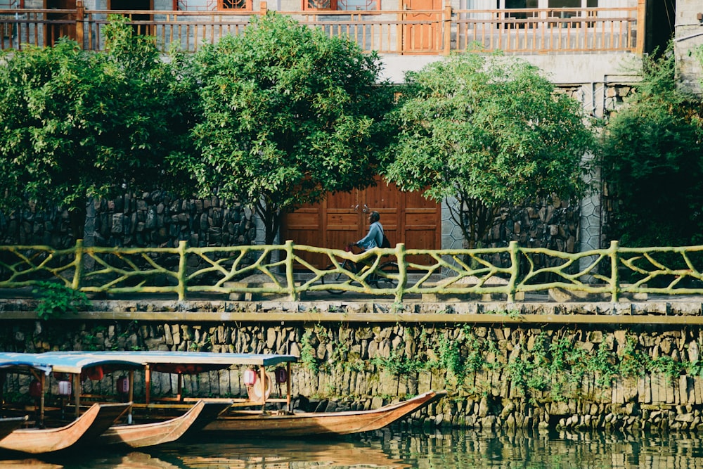 a couple of boats floating on top of a river