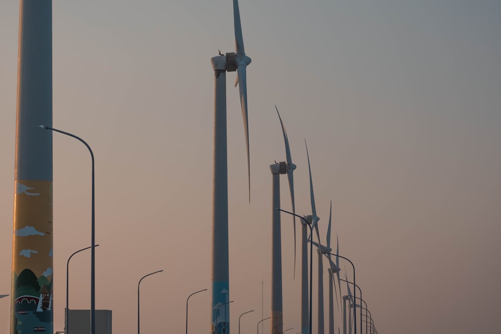 a row of wind turbines sitting next to each other
