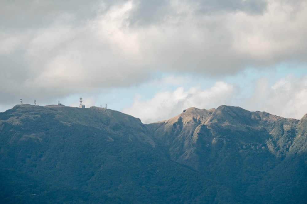 a mountain range with a radio tower on top of it