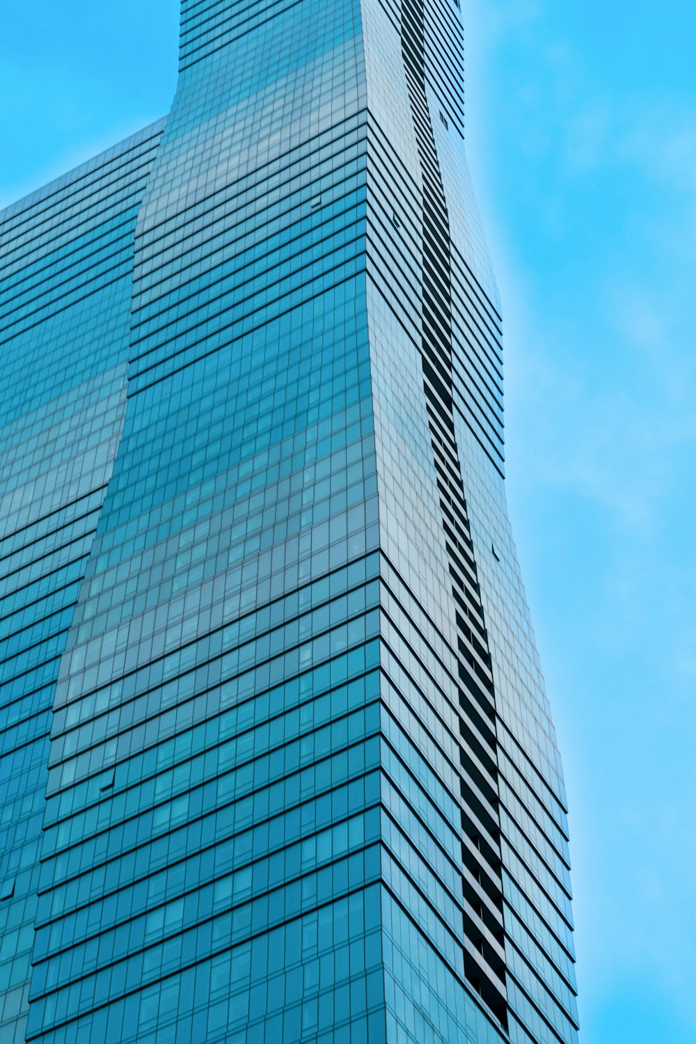 a very tall building with a very tall clock on it's side