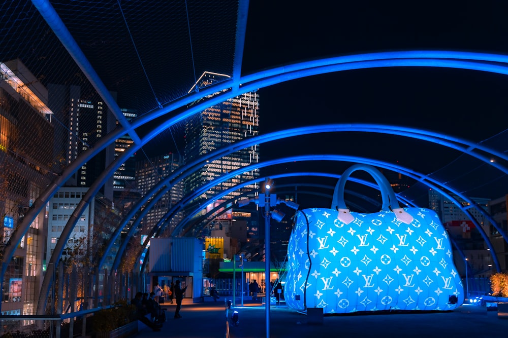 a large blue bag sitting in the middle of a street