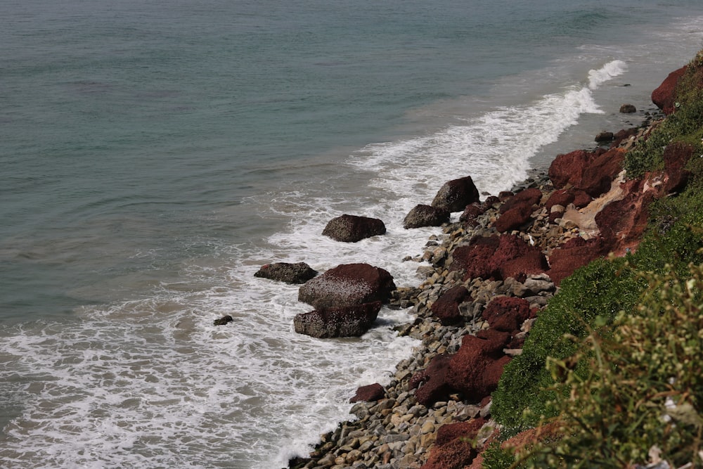 a view of the ocean from a rocky cliff