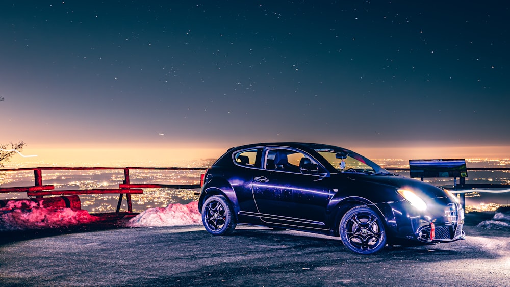 a car parked on a hill at night