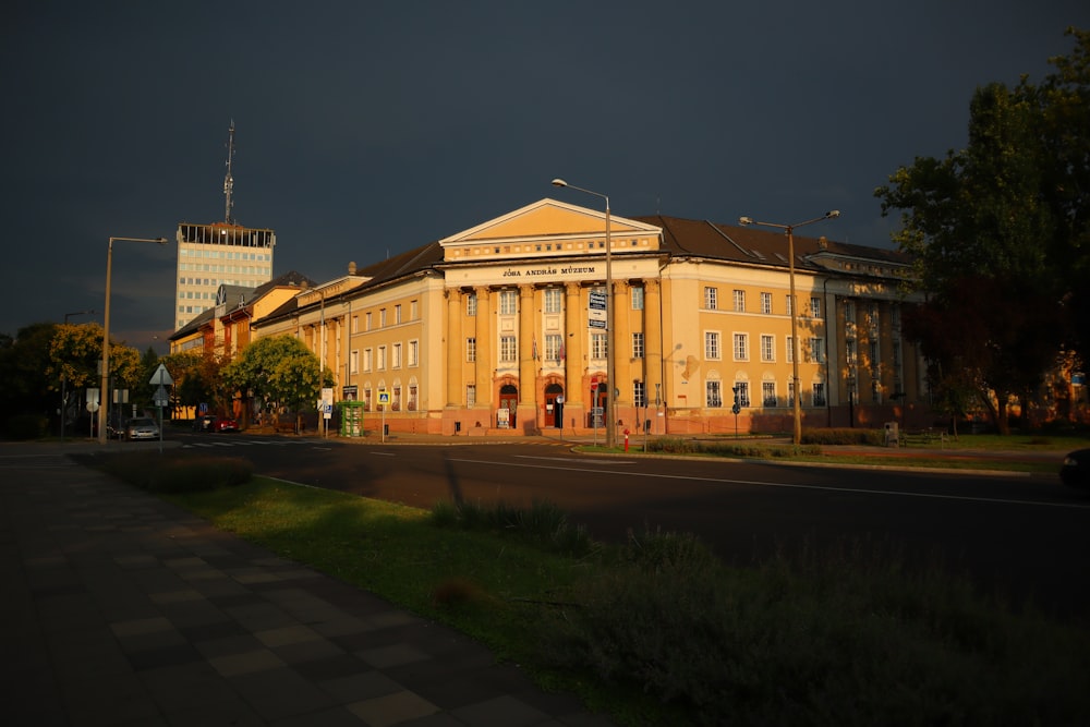 a large building sitting on the side of a road