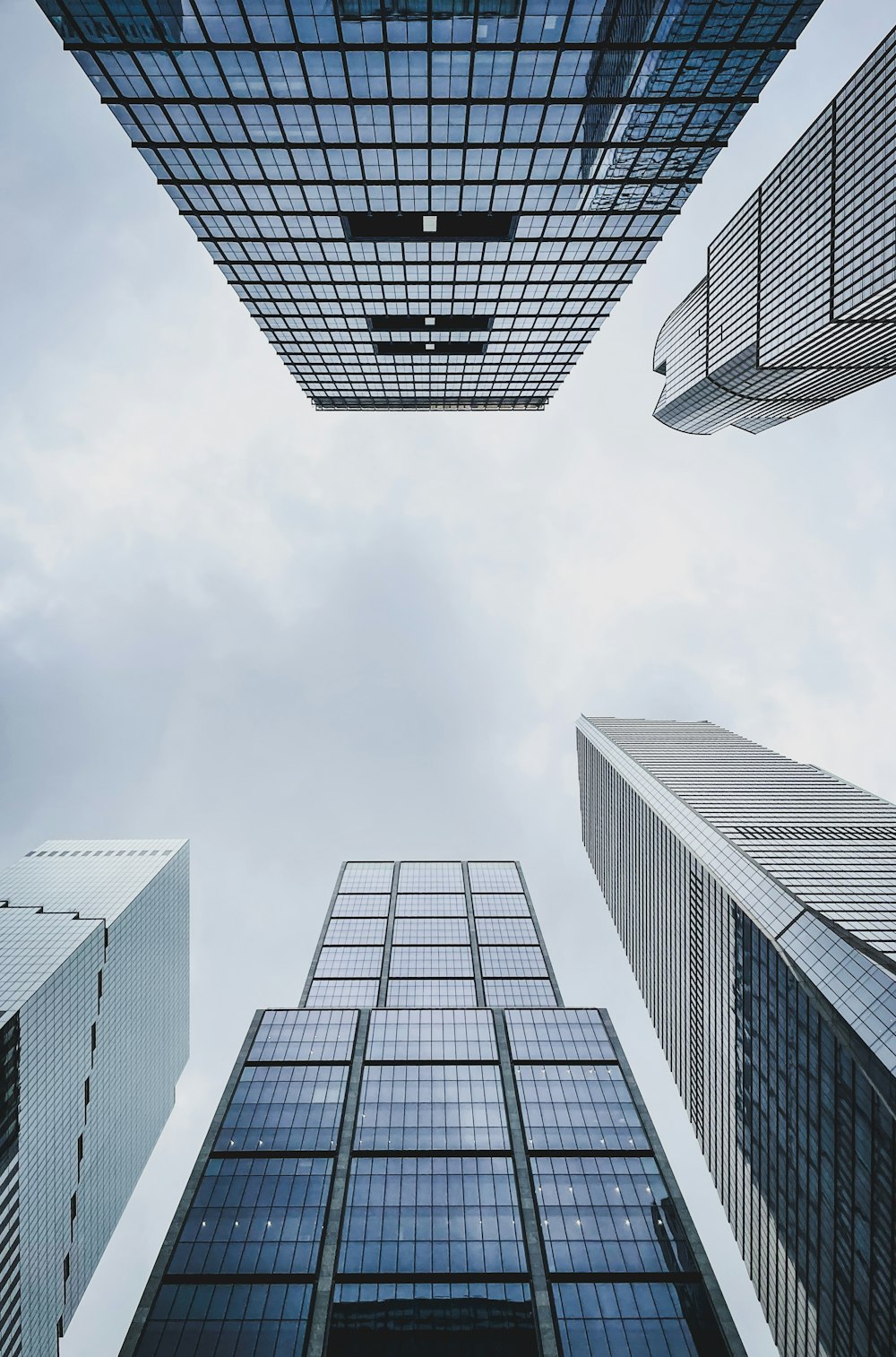 looking up at tall buildings in a city