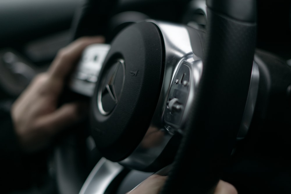 a close up of a person driving a car