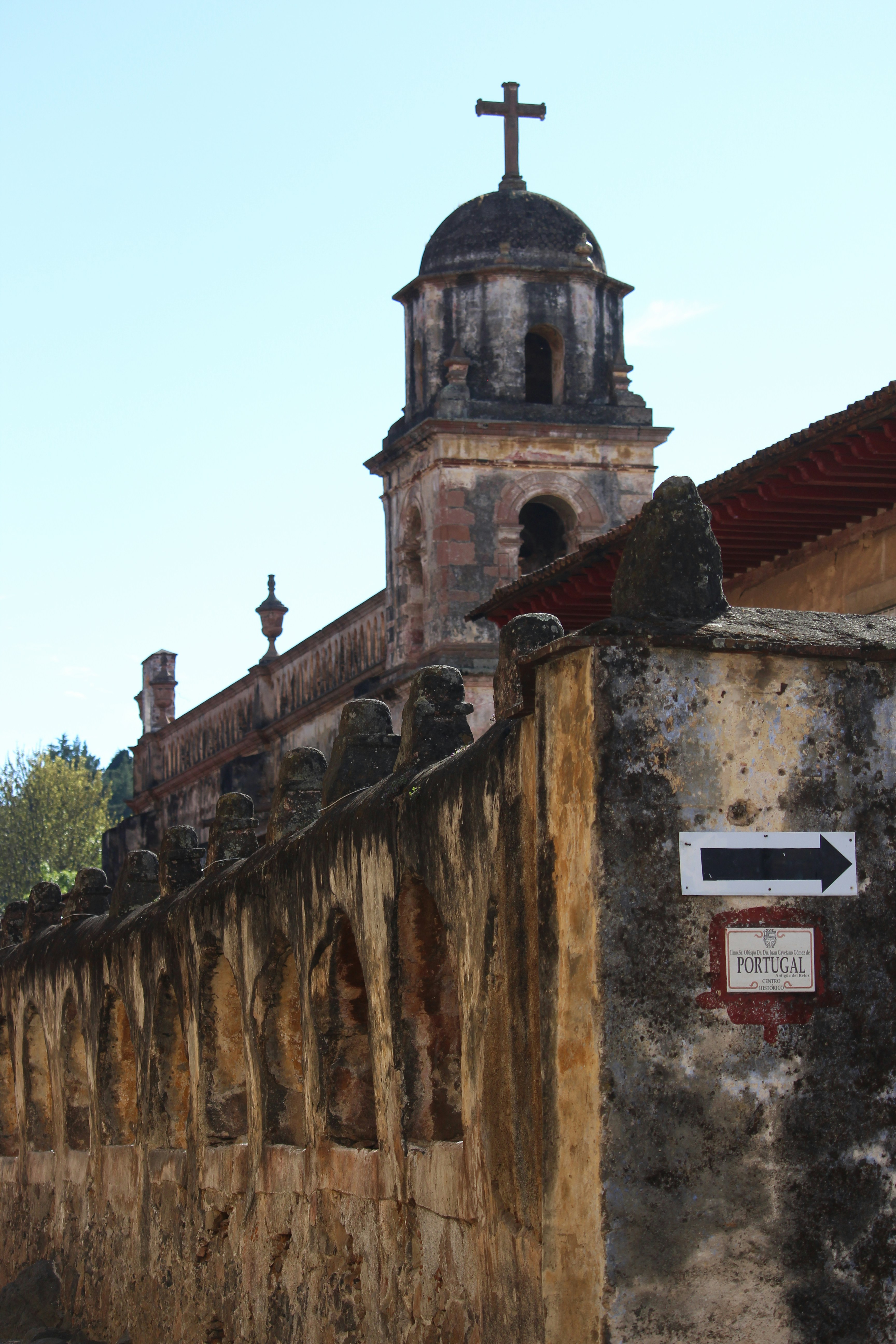 a church with a cross on the top of it