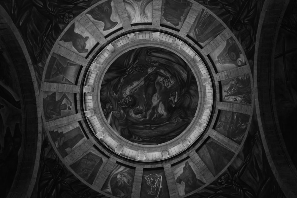 a black and white photo of the ceiling of a church