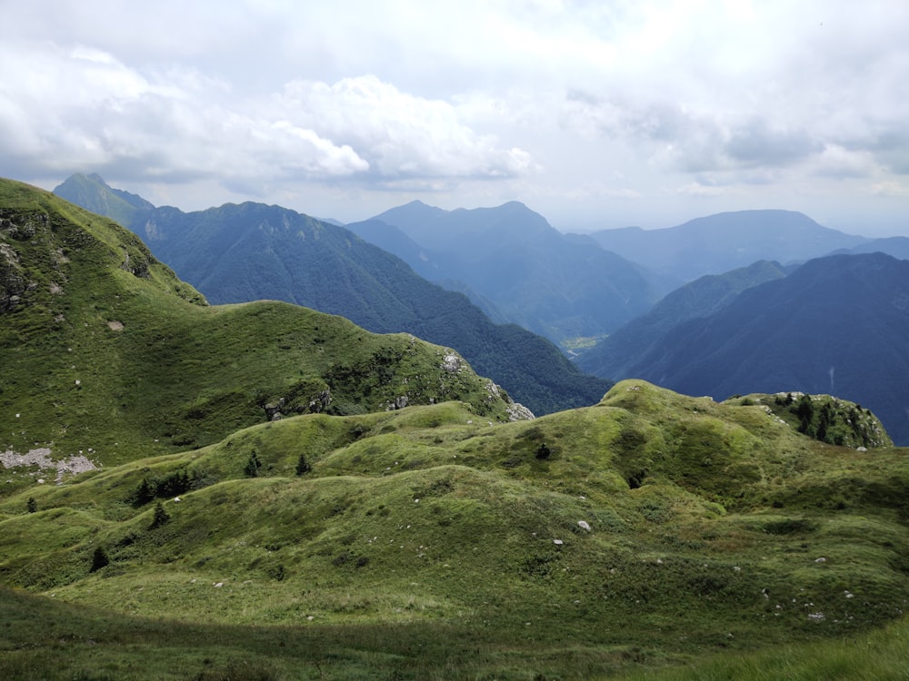 a view of a valley with mountains in the background