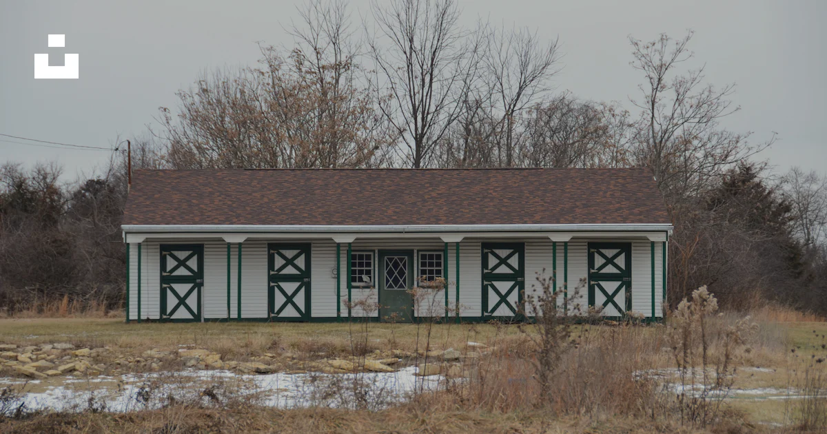 Building Ina Field A small green and white building in a field photo – Free Outdoors Image ...