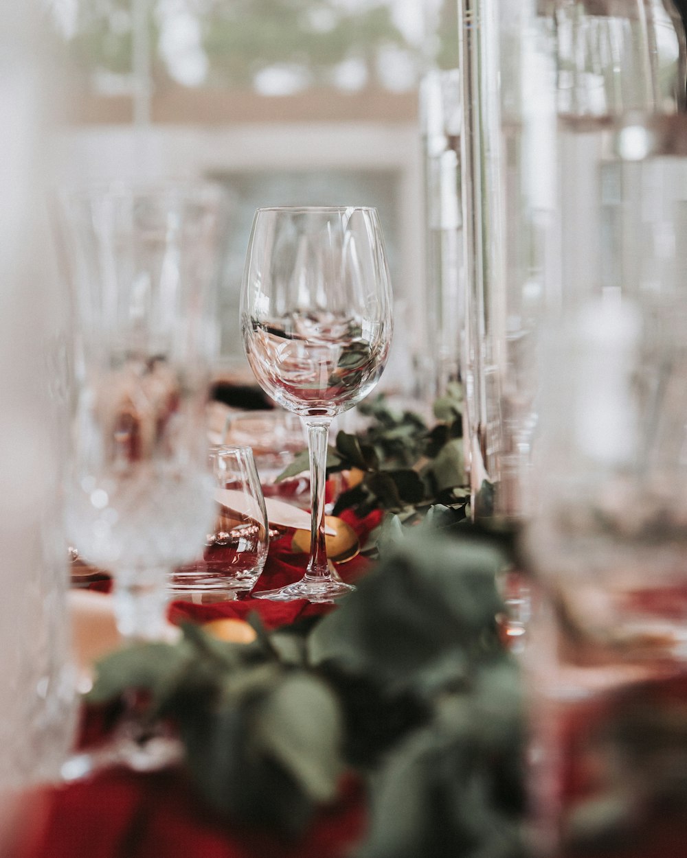 a close up of a wine glass on a table