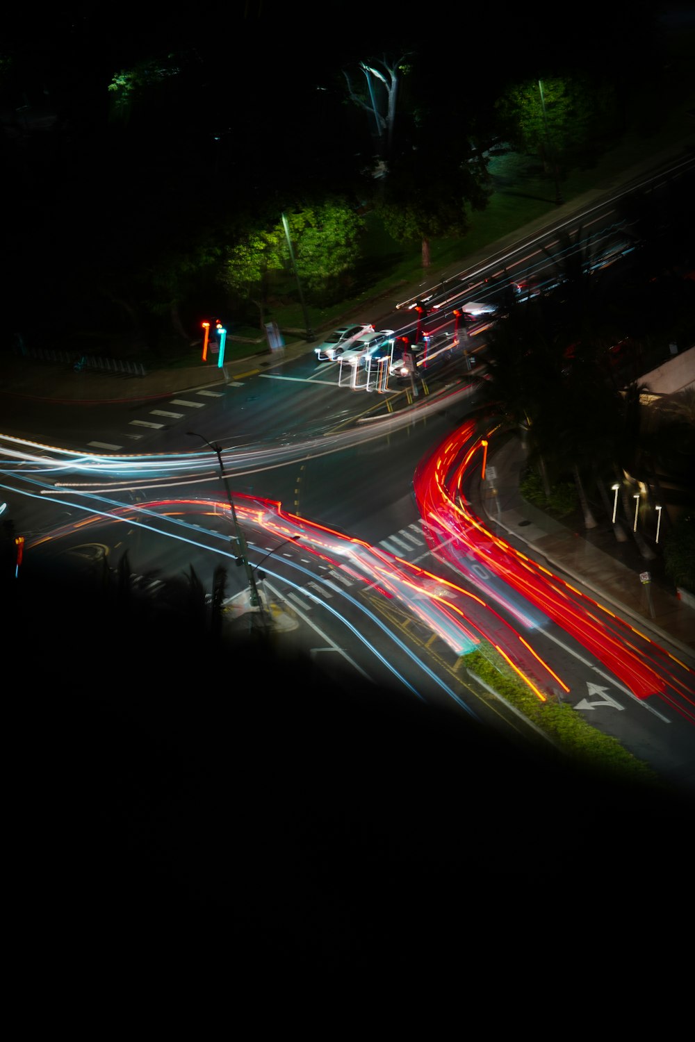 a city street filled with lots of traffic at night