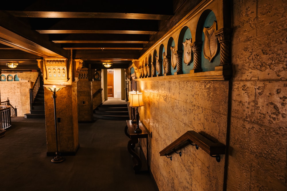 a dimly lit hallway with a clock on the wall