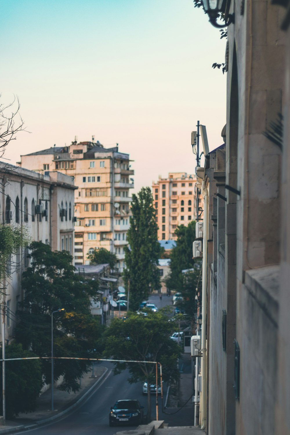 a view of a city street from a building