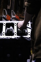 a close up of a person working on an engine