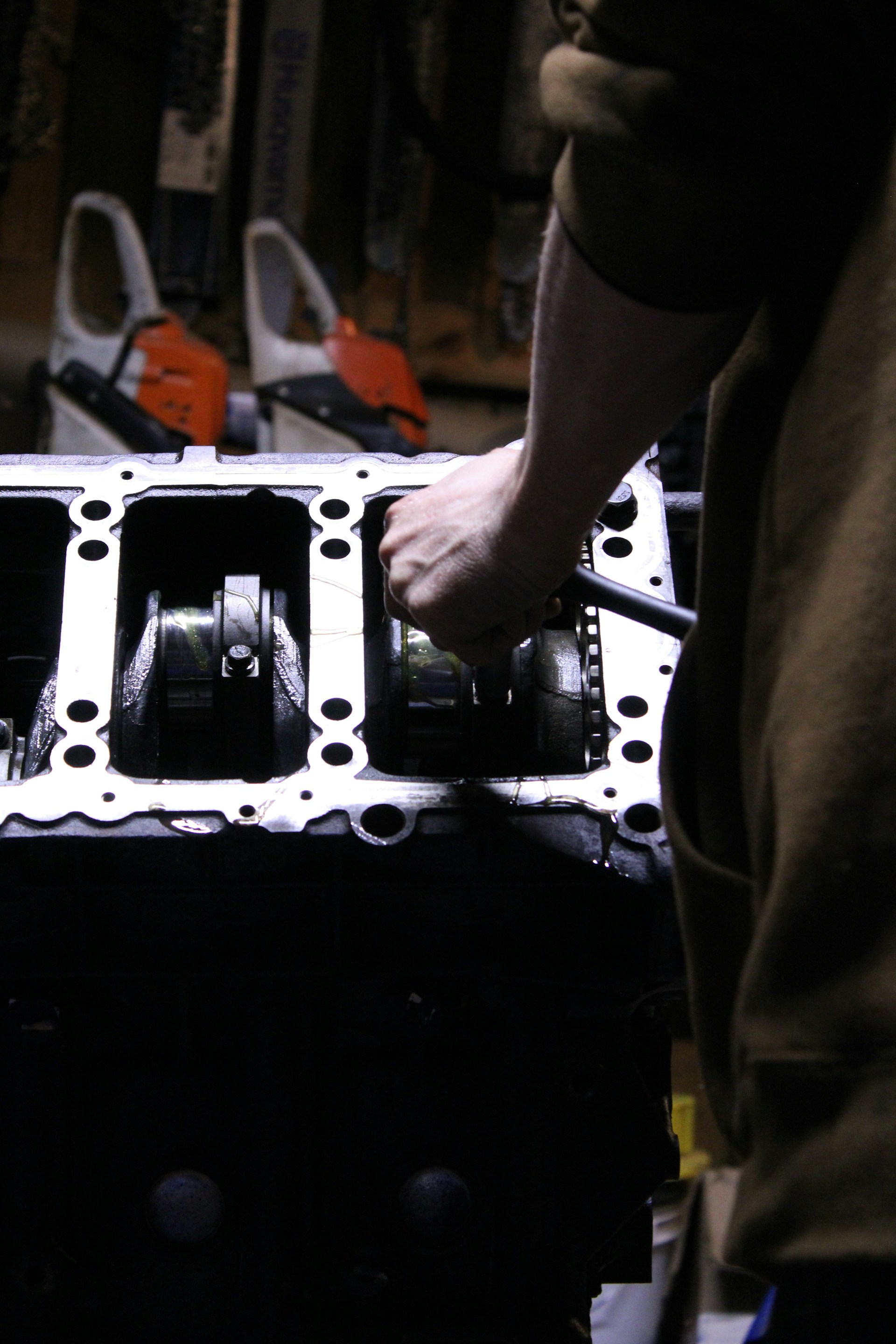 a close up of a person working on an engine