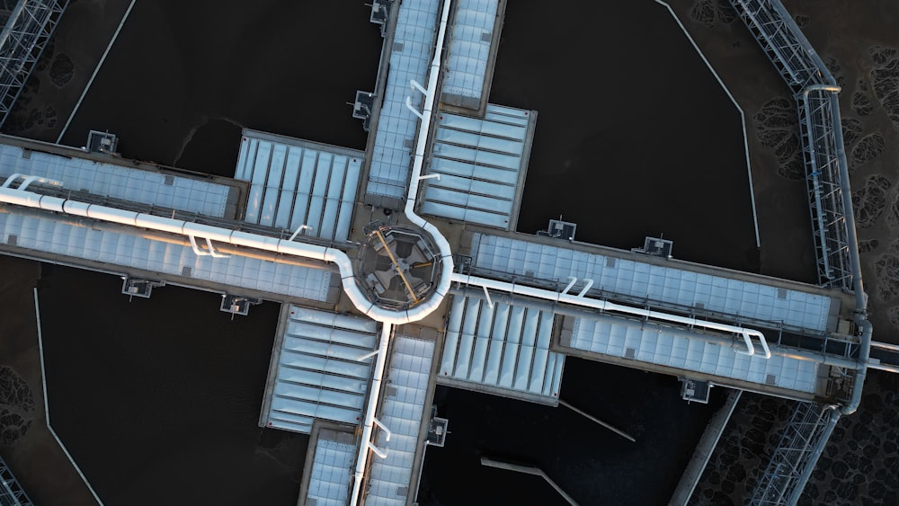 an aerial view of a clock on a bridge