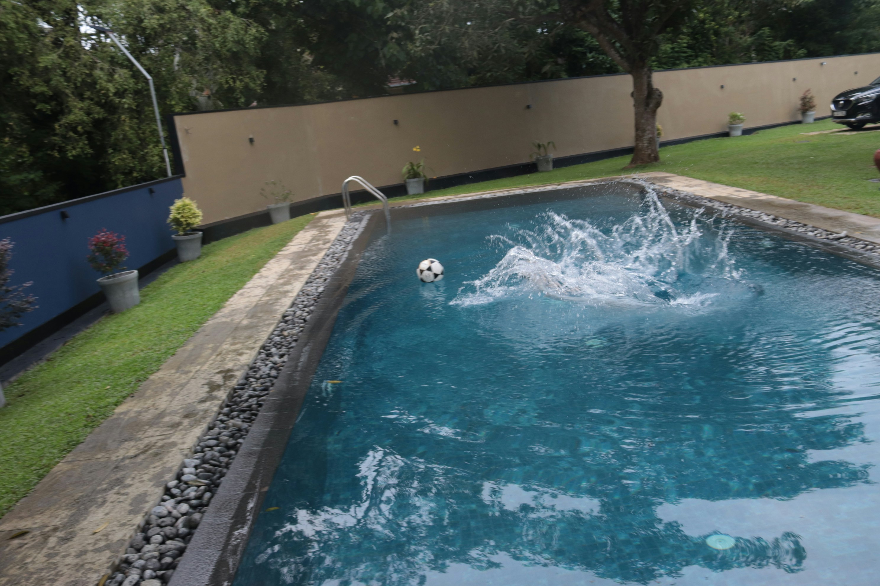 a pool with a soccer ball in it