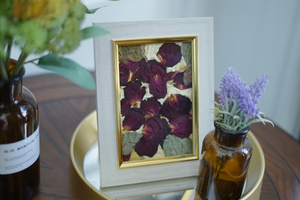 a picture of flowers in a vase on a table