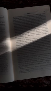 an open book sitting on top of a table