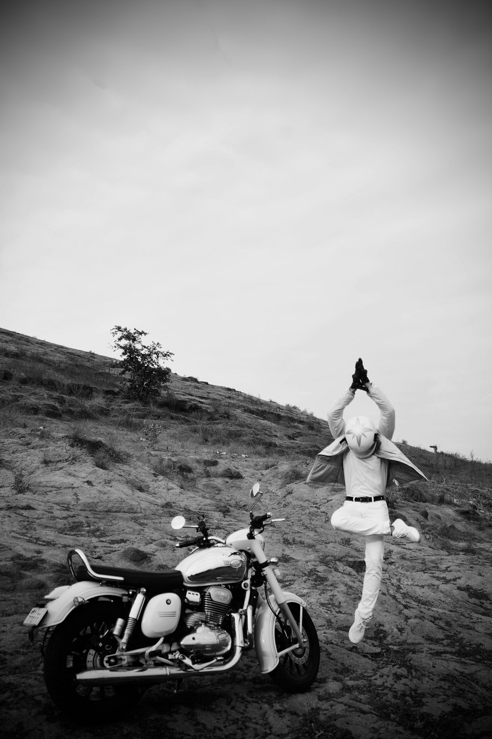 a woman in a bunny costume standing next to a motorcycle