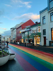 a rainbow painted street in a small town