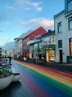 a rainbow painted street in a small town