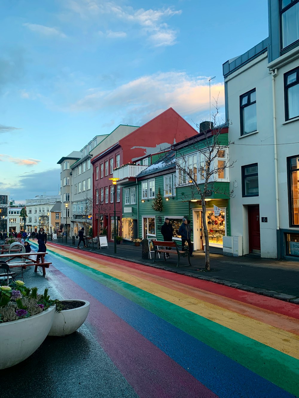 a rainbow painted street in a small town