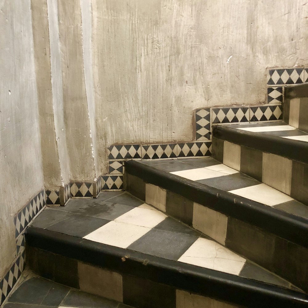 a set of black and white tiled stairs