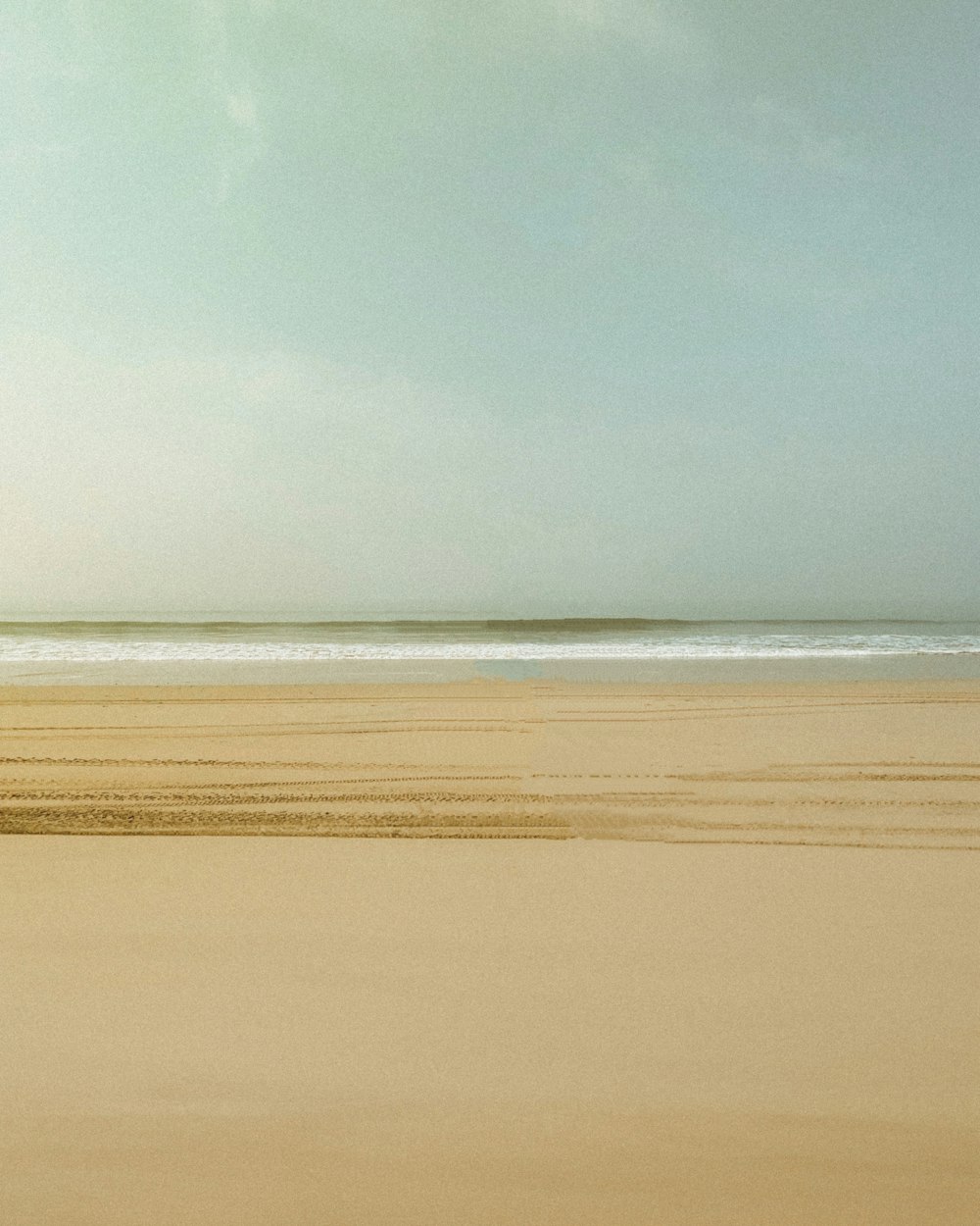 a person riding a horse on a beach