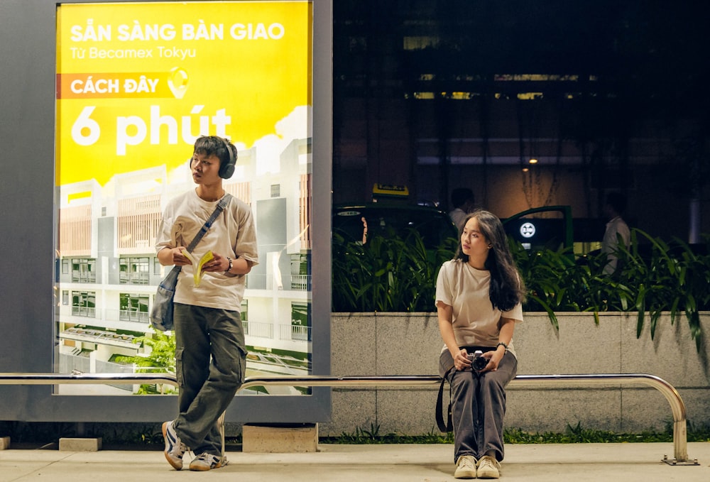 a man and a woman sitting on a bench