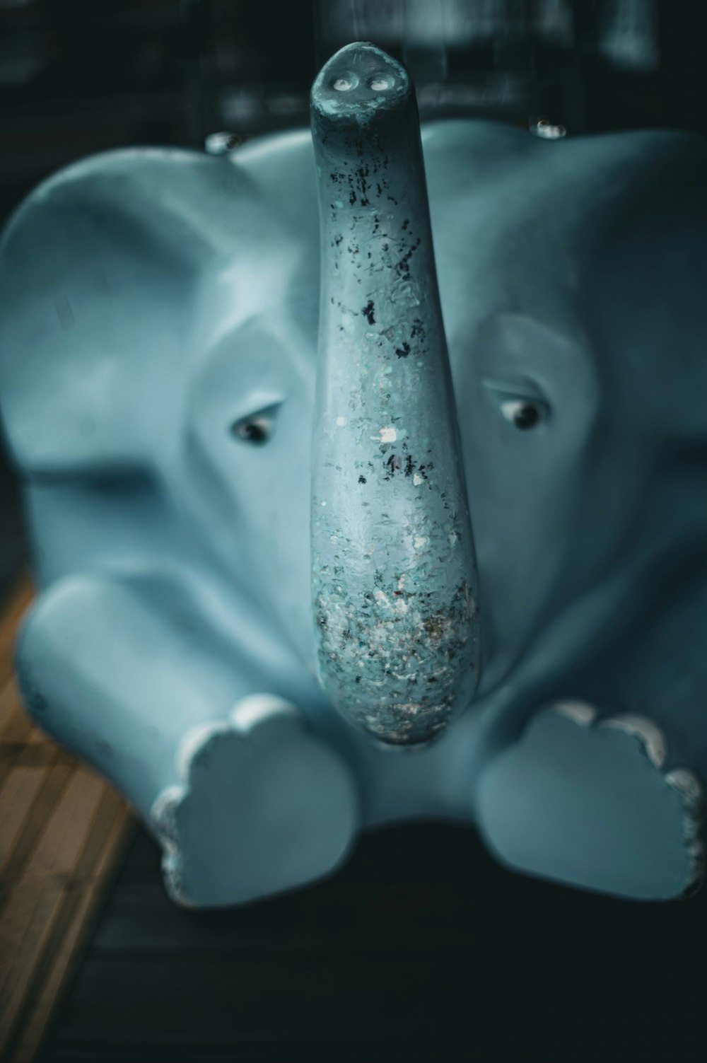 a close up of an elephant statue on a table