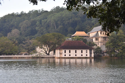 a large white building sitting on top of a lake