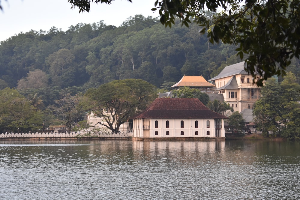 a large white building sitting on top of a lake