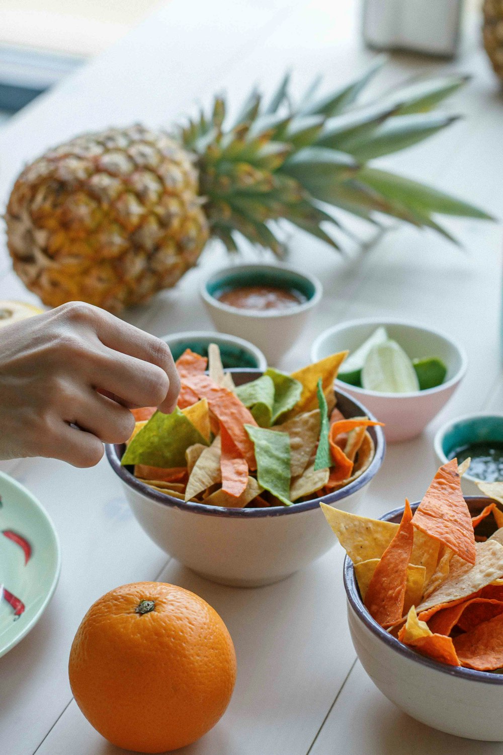 a table topped with bowls filled with different types of food