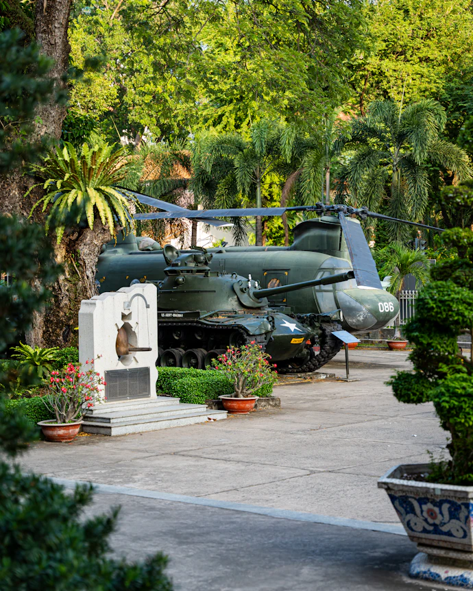 a military vehicle is parked in a garden