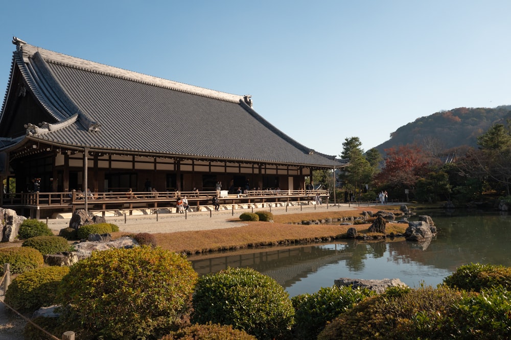 a building with a pond in front of it