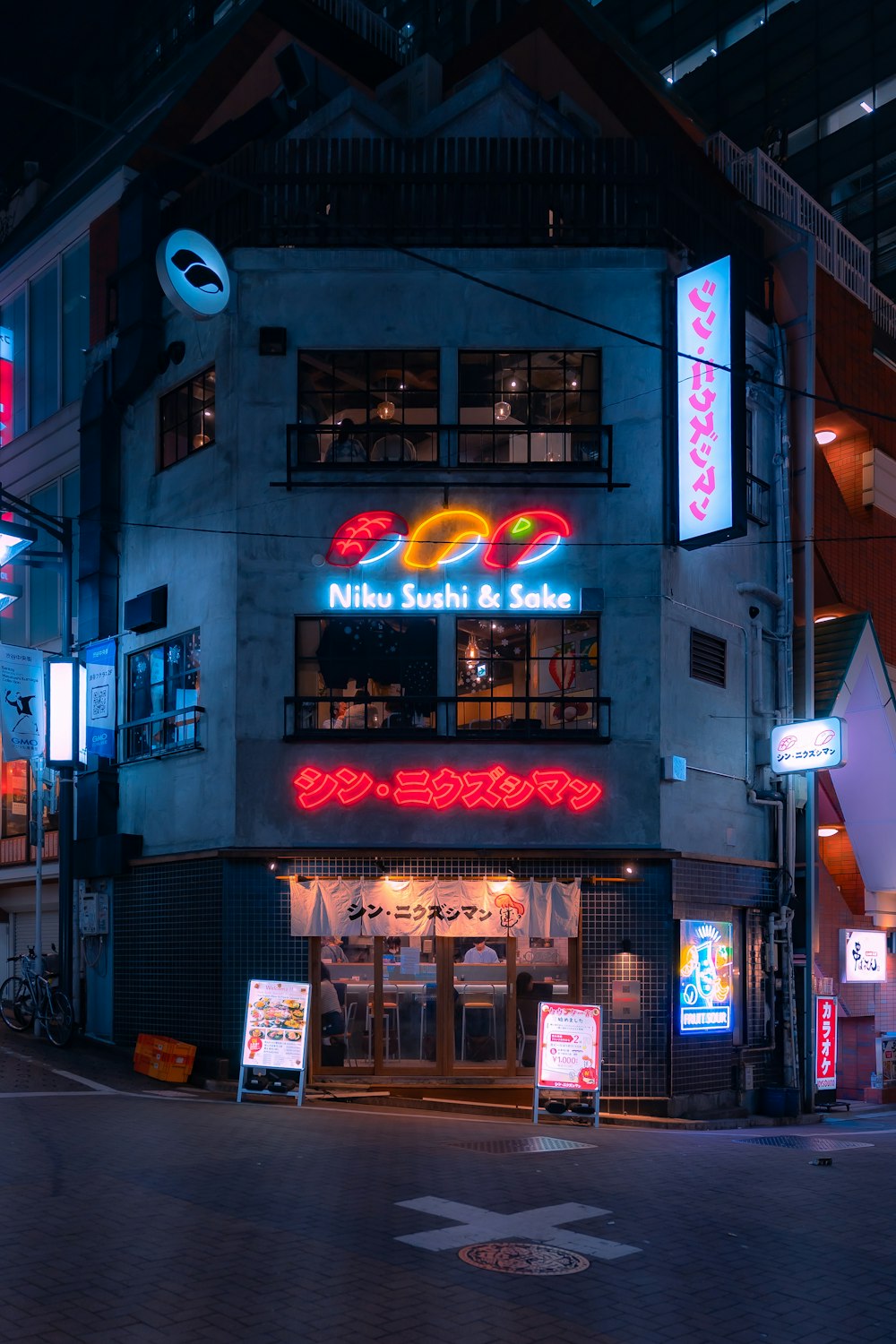 a building with a neon sign in front of it