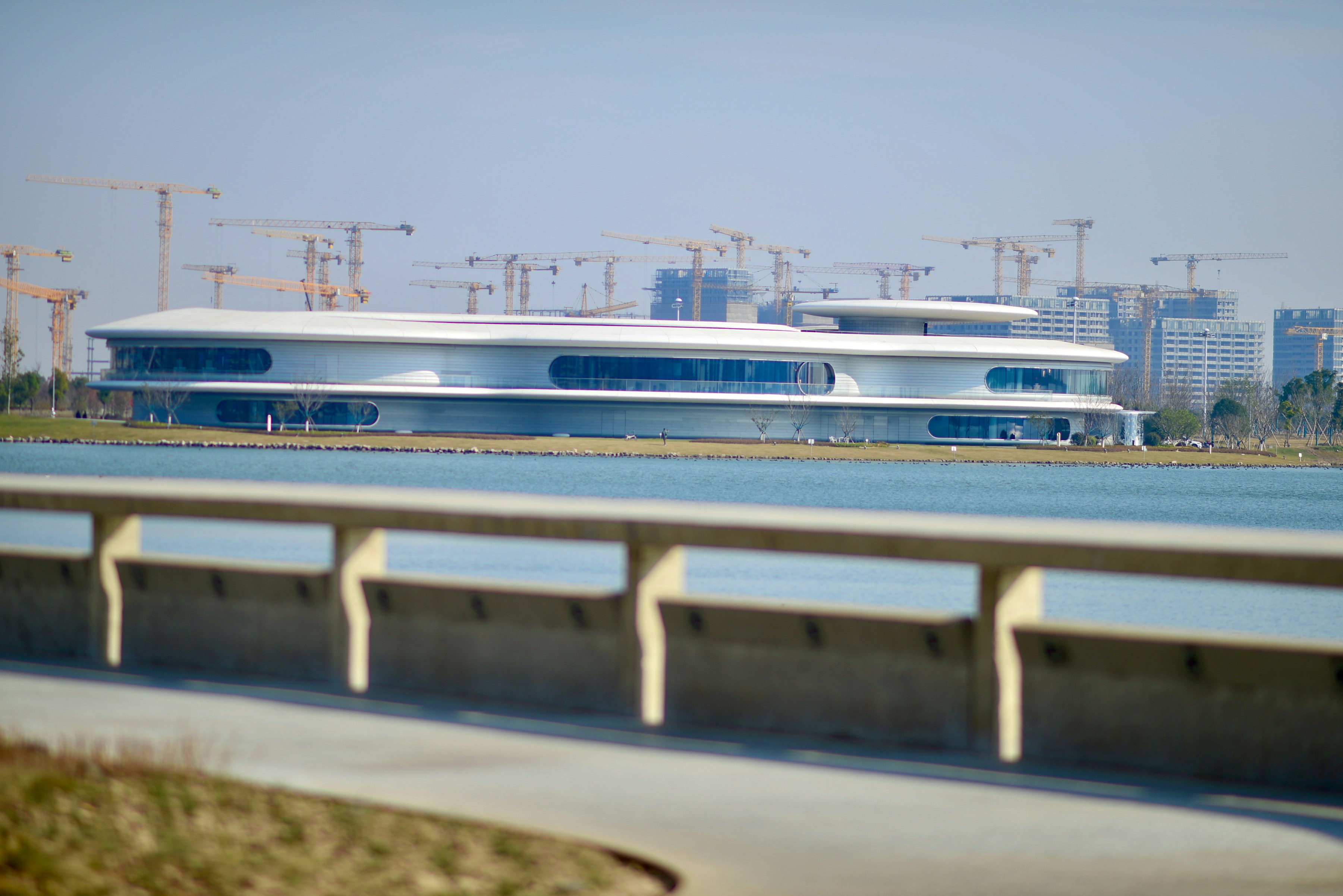 a large white boat sitting on top of a lake