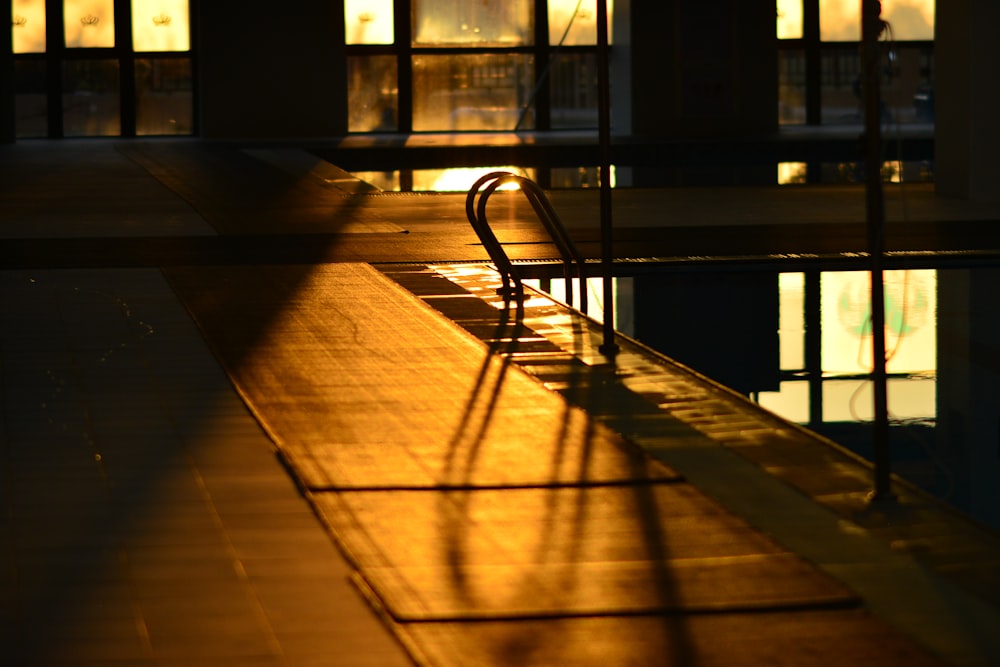 the reflection of a building in a pool of water