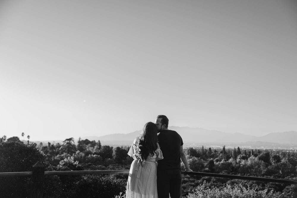 a man and a woman standing next to each other